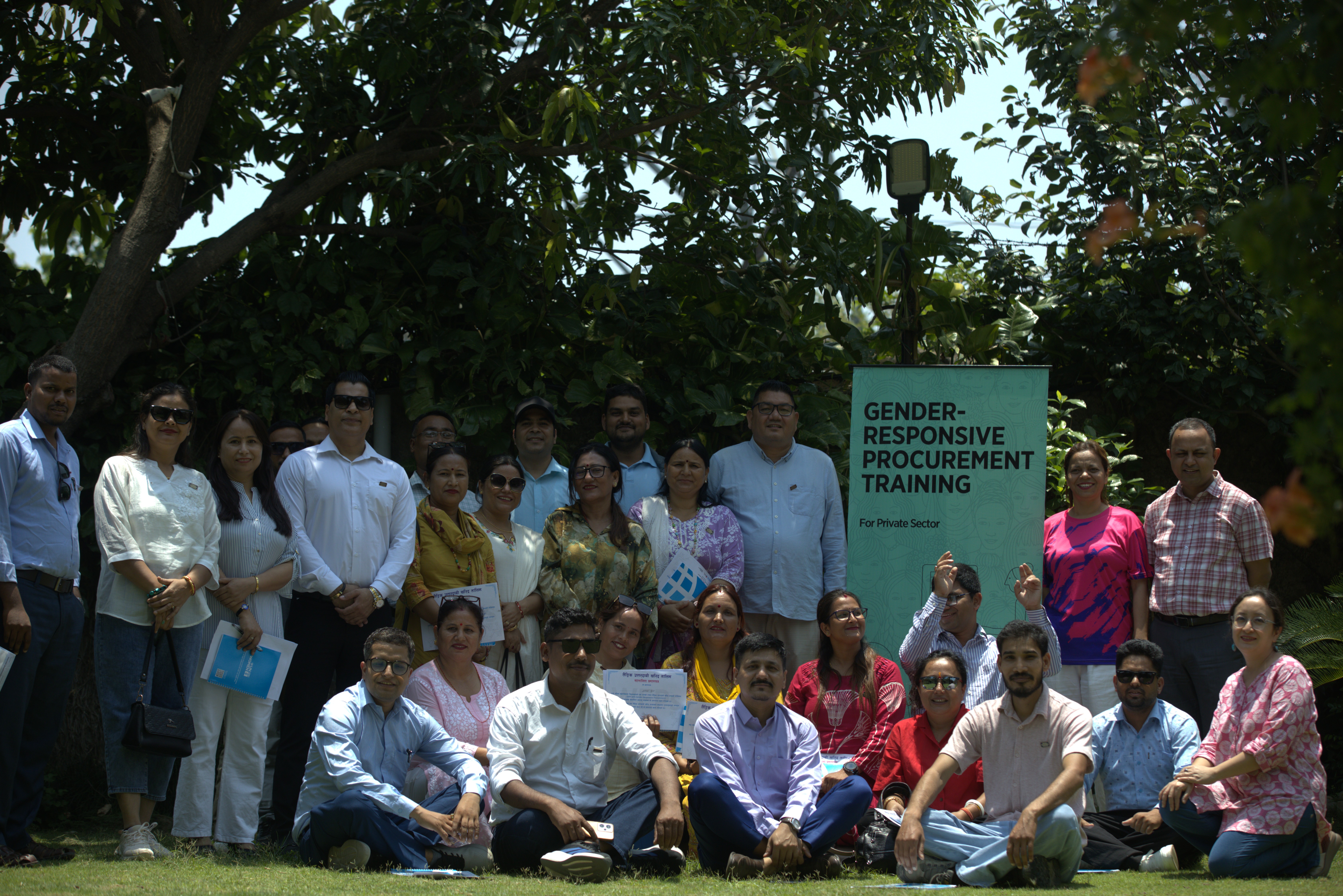 Group of people posting for photo outdoors